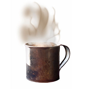 A tin cup filled with steaming hot tea