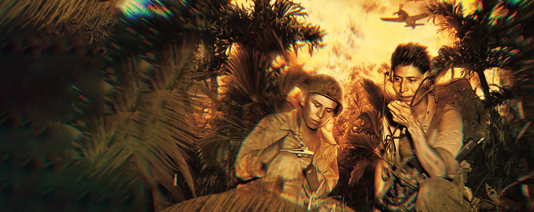 Image of two soliders in the jungle in the midst of battle